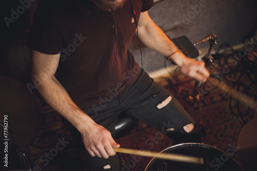 Young drummer playing at drums set Fototapeta