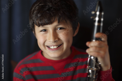 Smiling boy with clarinet