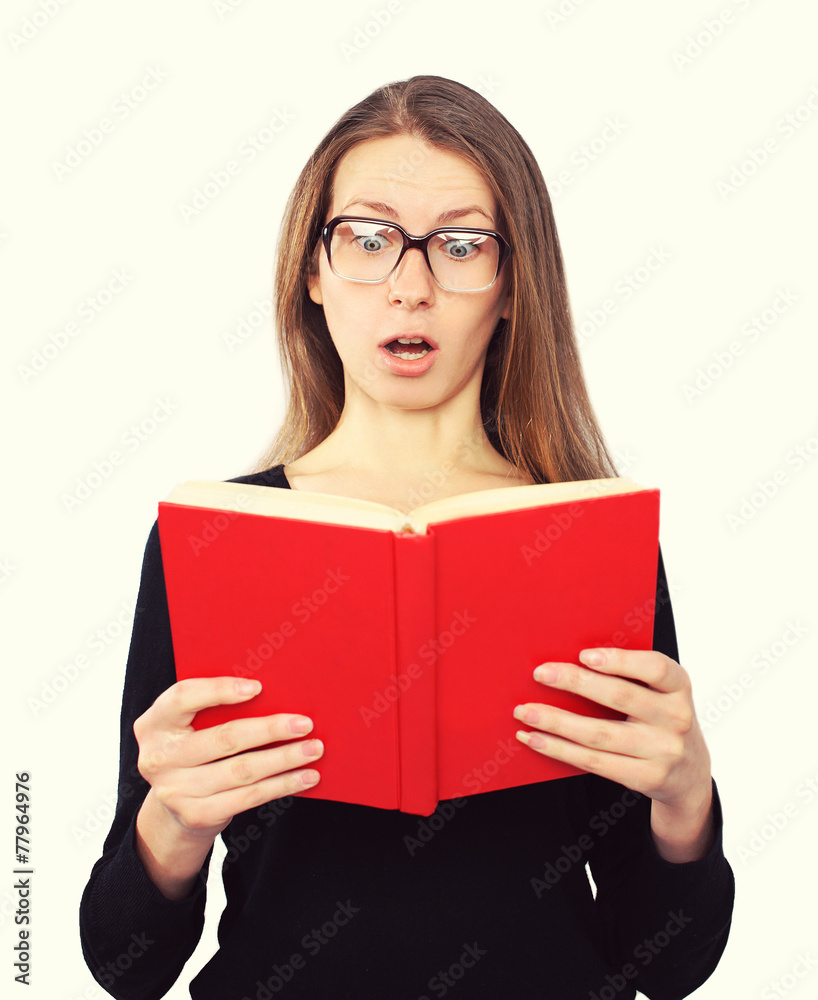 funny student girl in glasses shocked looking in the book funny student girl in glasses shocked looking in the book