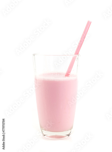Glass of strawberry milk on white