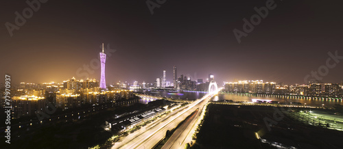traffic blur motion on bridge with night cityscape background