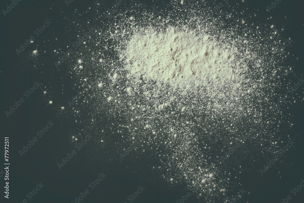 white podwer blast over black textured background white podwer blast over black textured background
