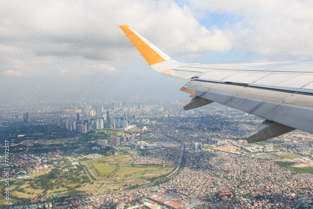 Airplane flying over Manila, Philippines