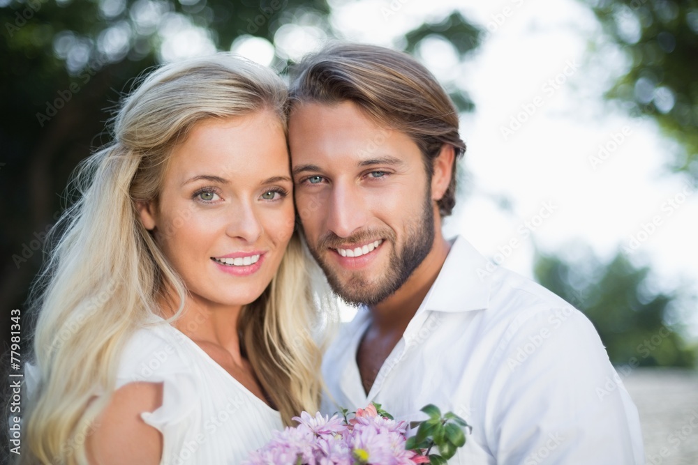 Attractive couple smiling at camera Attractive couple smiling at camera