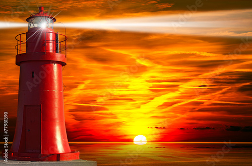 Red Lighthouse with Light Beam at Sunset