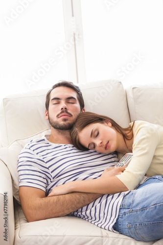 Cute couple napping on couch