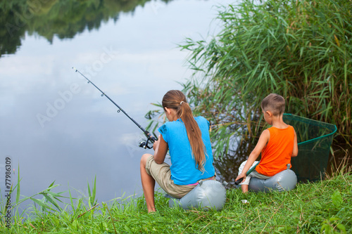 Kids fishing at the river