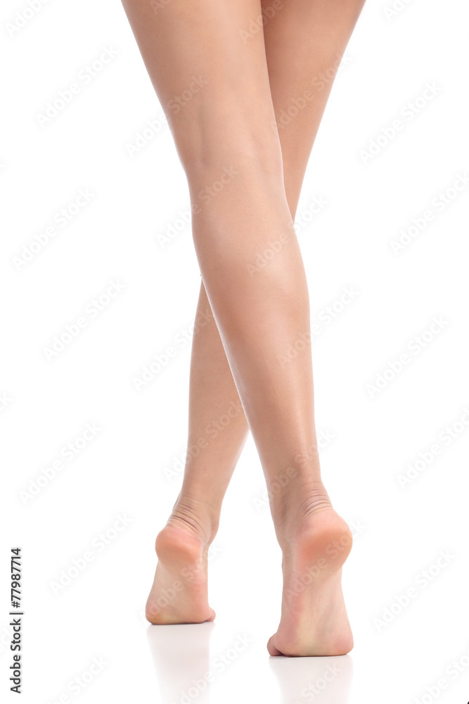 Back view of sexy waxing smooth woman legs and feet walking Stock Photo