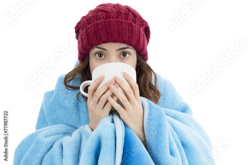 Woman feeling cold and drinking warm tea