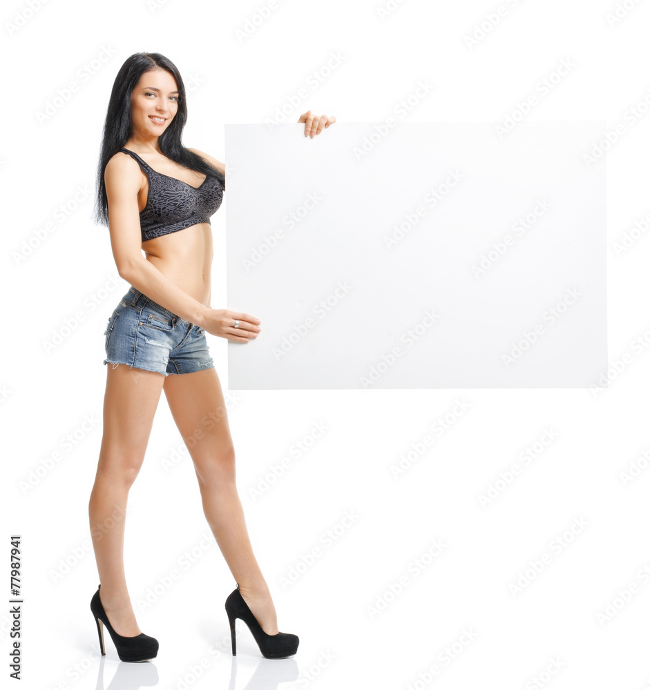 Sexy young girl standing and holding a white plate isolated on w Sexy young girl standing and holding a white plate isolated on w