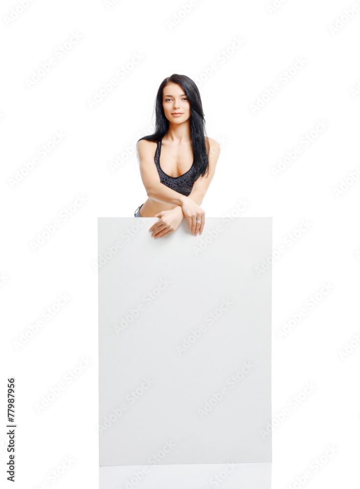 Sexy young girl standing and holding a white plate isolated on w Sexy young girl standing and holding a white plate isolated on w