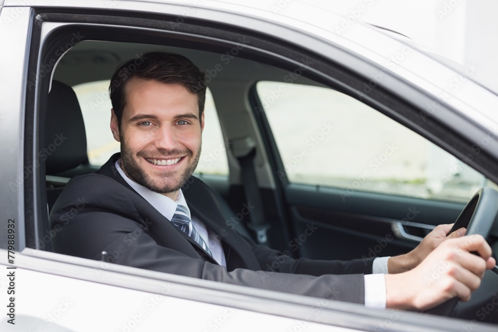 Businessman sitting in drivers seat