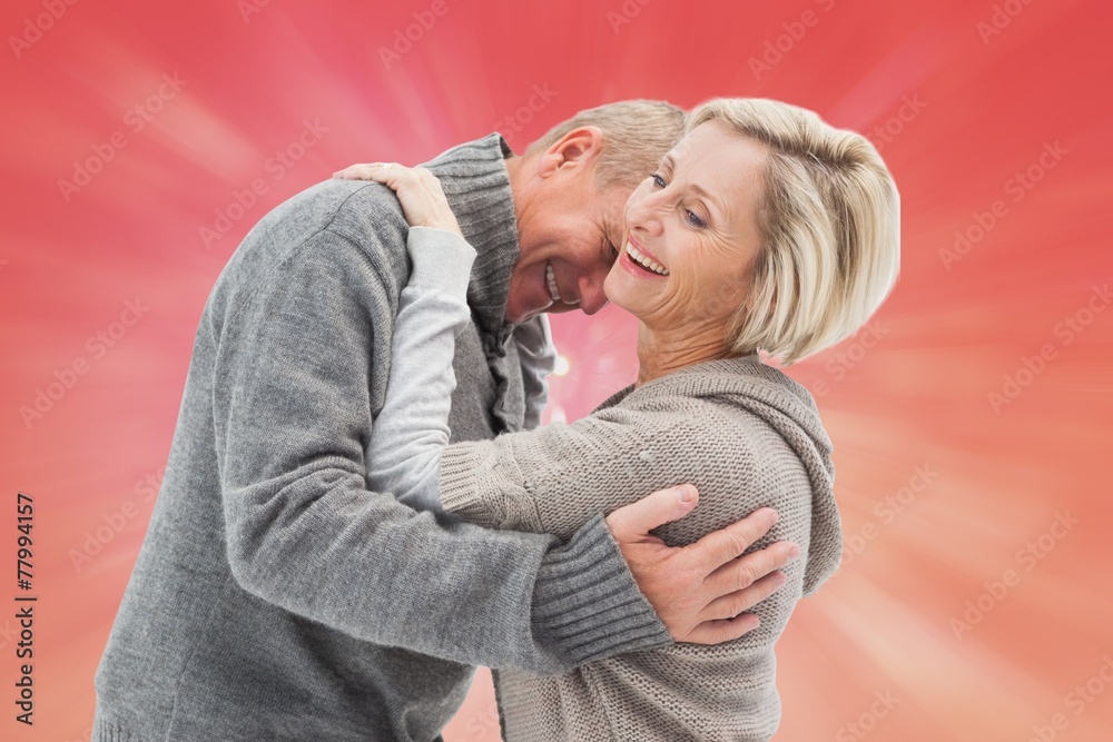 Composite image of happy mature couple in winter clothes Composite image of happy mature couple in winter clothes