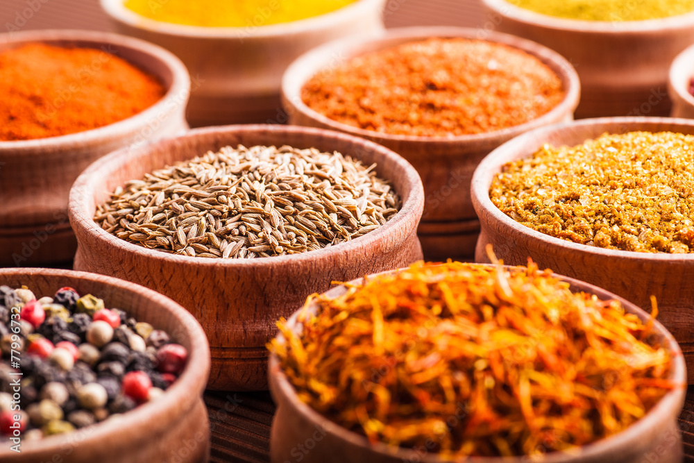 spices in a wooden bowl close-up spices in a wooden bowl close-up
