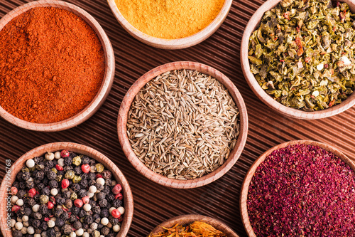 set dry spices in a wooden bowl close-up