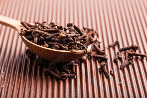 Wallpaper Mural clove in a wooden spoon Torontodigital.ca