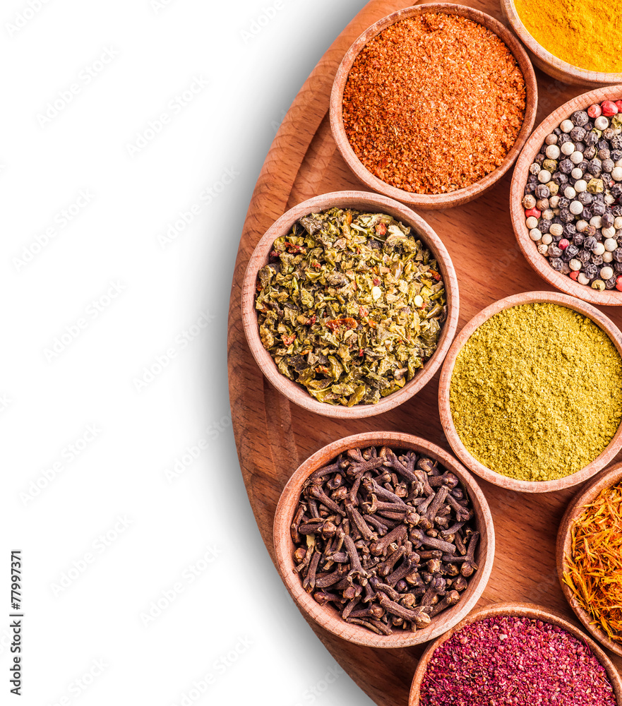 assorted spices in a wooden bowl