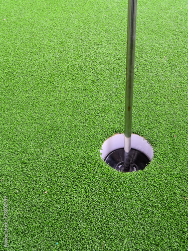 Golf hole with green grass.