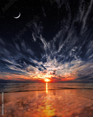 Beautiful sunset on the beach, stars and moon on the sky