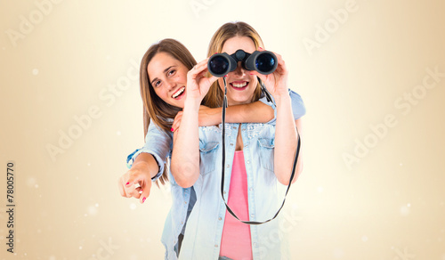Friends with binoculars over isolated white background