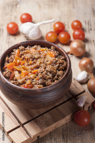 Minced meat stewed with cherry tomatoes, onion and garlic in a c
