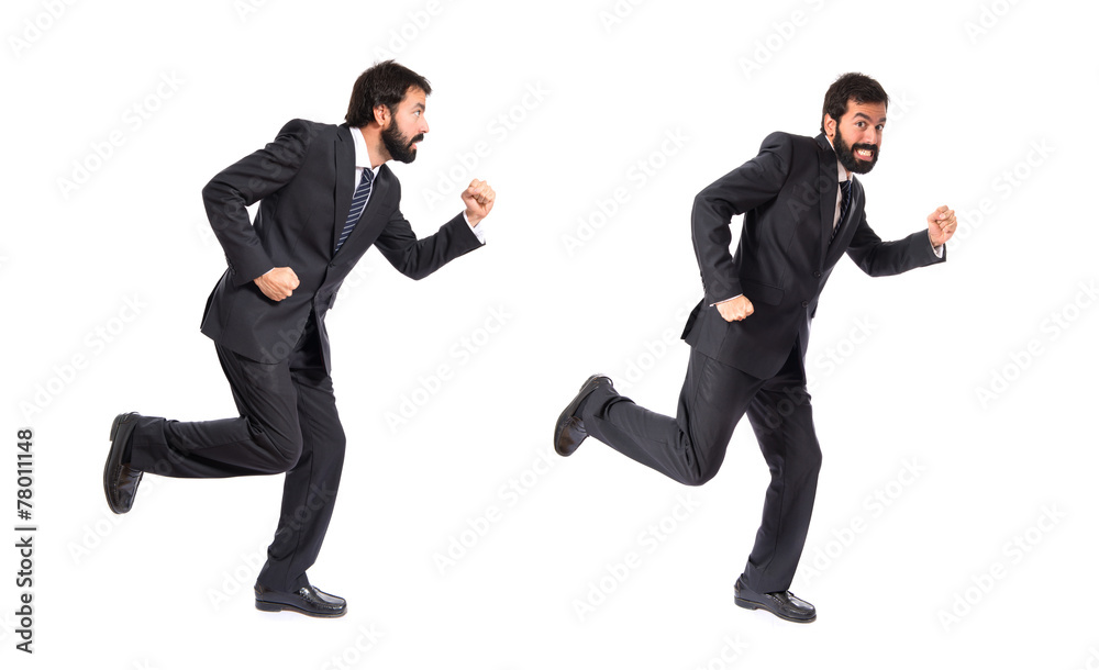Businessman running fast over white background Businessman running fast over white background