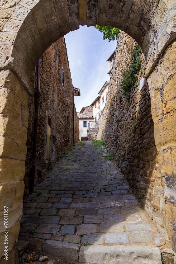 street of medieval town in Tuscany, Italy