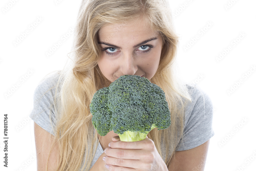 Attractive Young Woman Holding Raw Broccoli Attractive Young Woman Holding Raw Broccoli