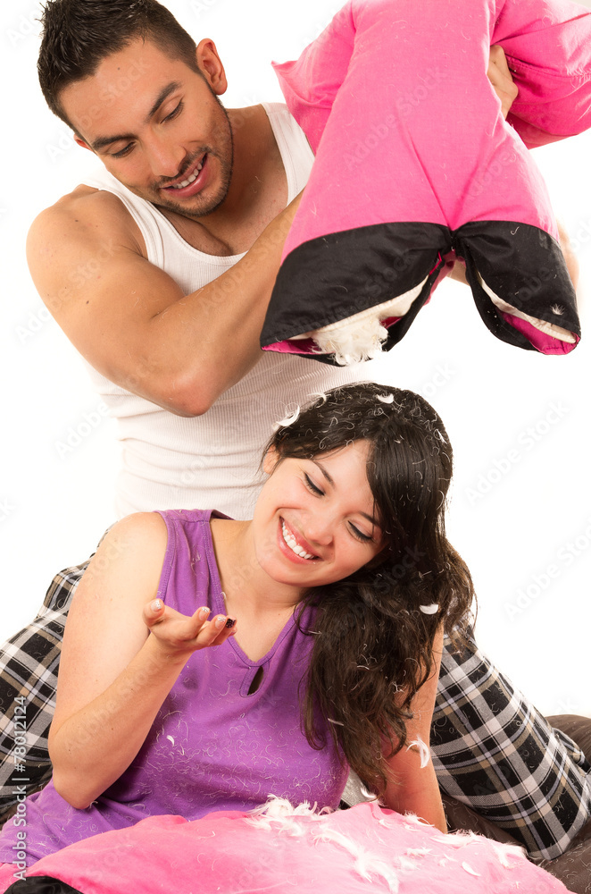 Obraz premium cute attractive couple having a pillow fight