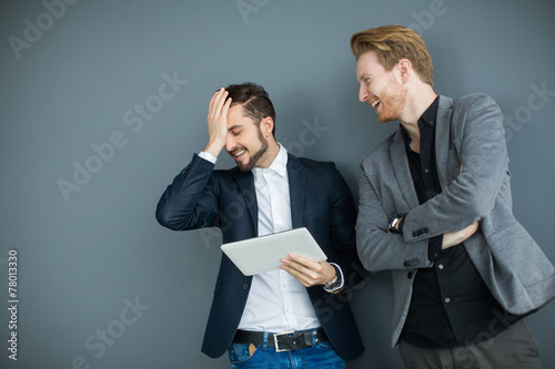 Young men with tablet