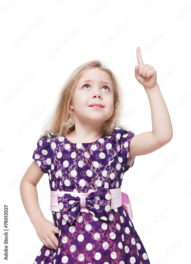 Beautiful little girl showing on something by finger isolated Beautiful little girl showing on something by finger isolated