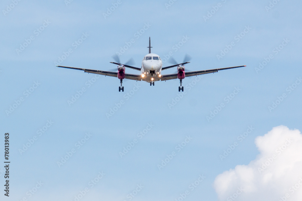 Propeller Plane Landing with Clouds