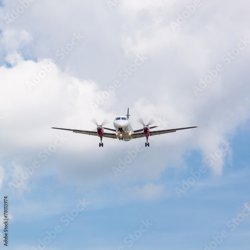 Propeller Plane Landing with Clouds