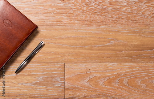 daily log and the handle on a wooden background