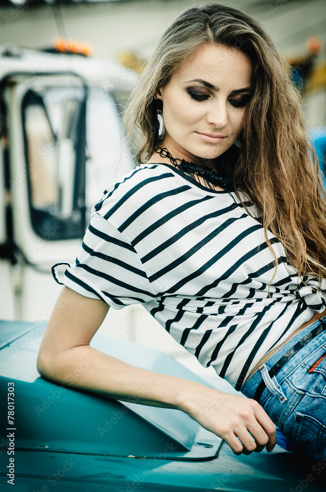 Young sexy girl in blue shorts on the truck Stock Photo | Adobe Stock