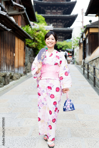 young asian woman wearing kimono walking © taka