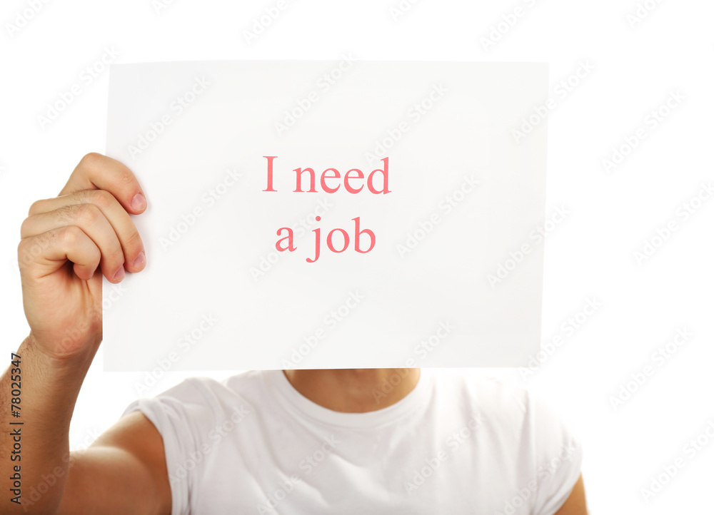 Sheet of paper with inscription I need a job in male hand Sheet of paper with inscription I need a job in male hand