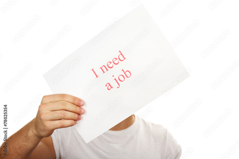 Sheet of paper with inscription I need a job in male hand Sheet of paper with inscription I need a job in male hand