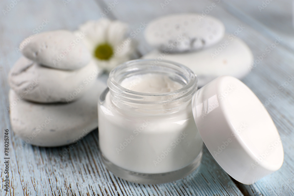Cosmetic cream with spa stones and chamomile Cosmetic cream with spa stones and chamomile