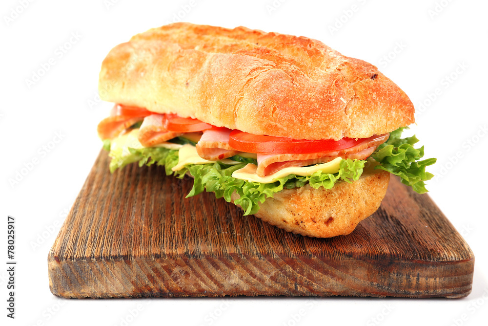 Fresh sandwich on wooden cutting board isolated on white Fresh sandwich on wooden cutting board isolated on white