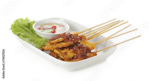 Grilled pork satay with sauce on plate
