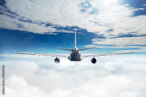 Airplane over the clouds