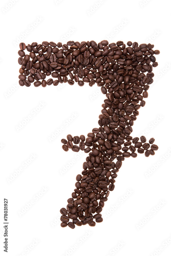 Roasted coffee beans placed in the shape of number seven Roasted coffee beans placed in the shape of number seven