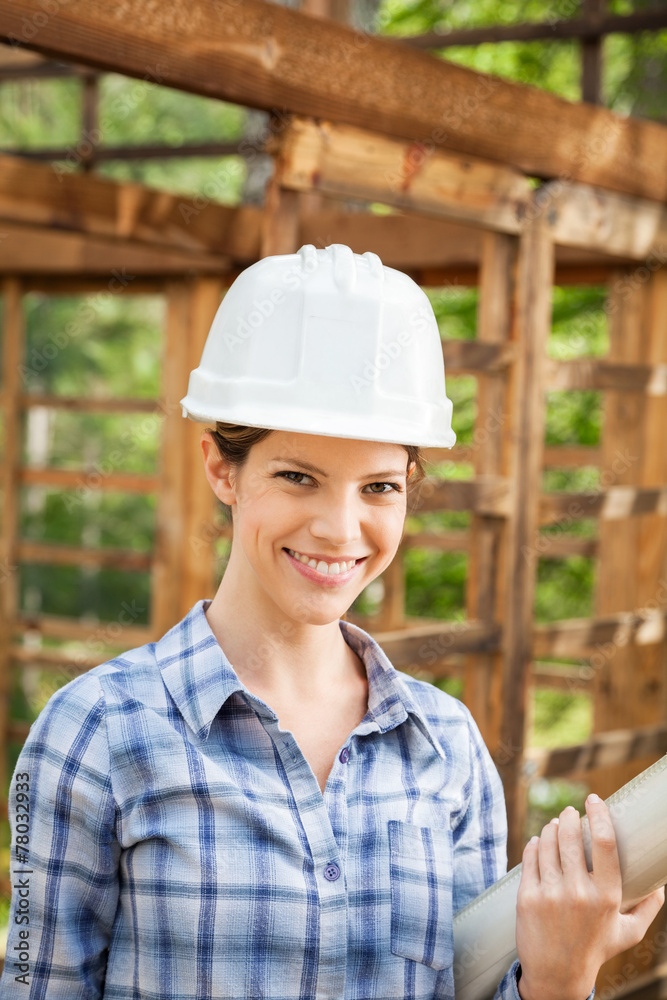 Beautiful Architect Holding Blueprint At Construction Site Beautiful Architect Holding Blueprint At Construction Site