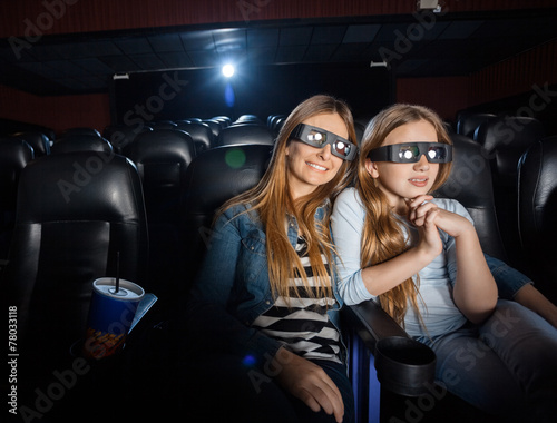Mother And Daughter Watching 3D Movie In Theater © Tyler Olson