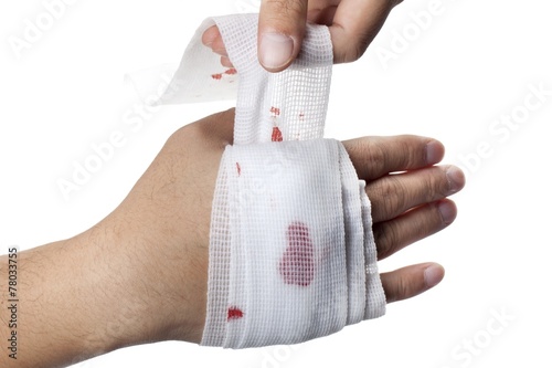 Fototapeta person dressing wounded hand