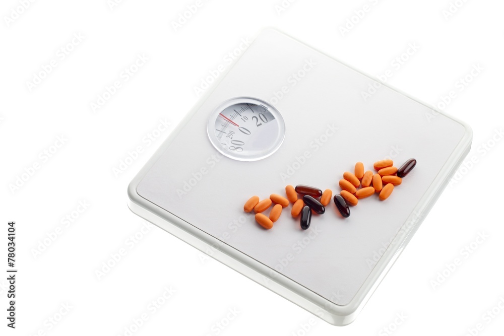 weighting scale and pills Stock Photo | Adobe Stock