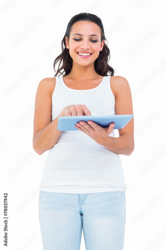 Pretty brunette using tablet pc Pretty brunette using tablet pc