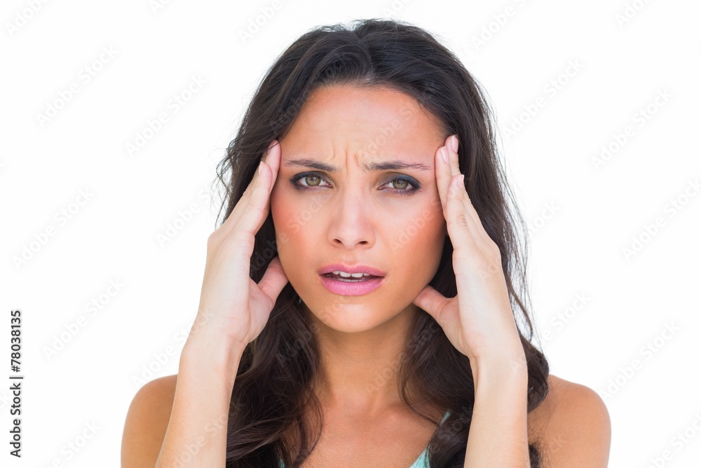 Pretty brunette getting a headache
