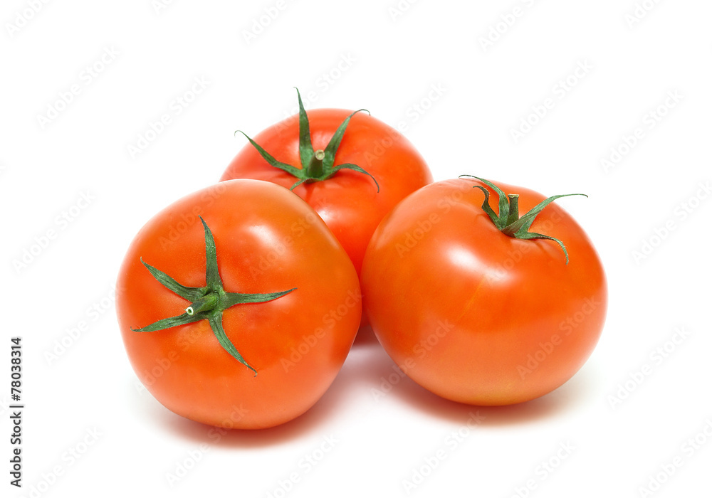 three ripe tomatoes closeup isolated on white background